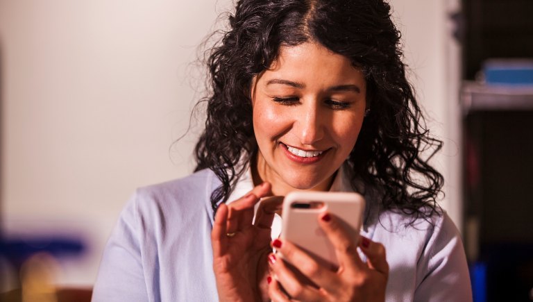 Woman looking at a cell phone.